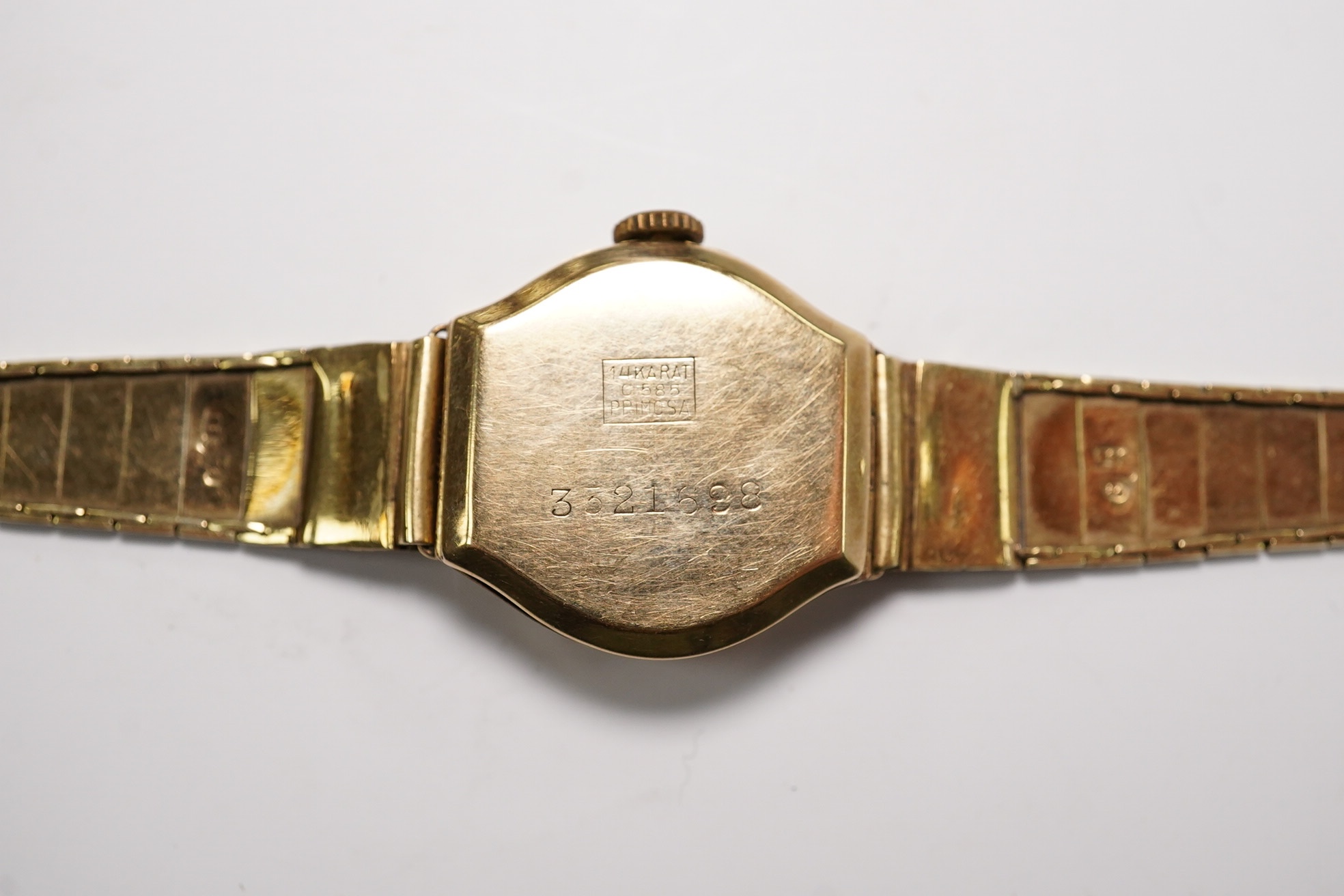 A lady's 14k manual wind wrist watch, on a 14k bracelet, gross weight 14 grams. Condition - poor to fair